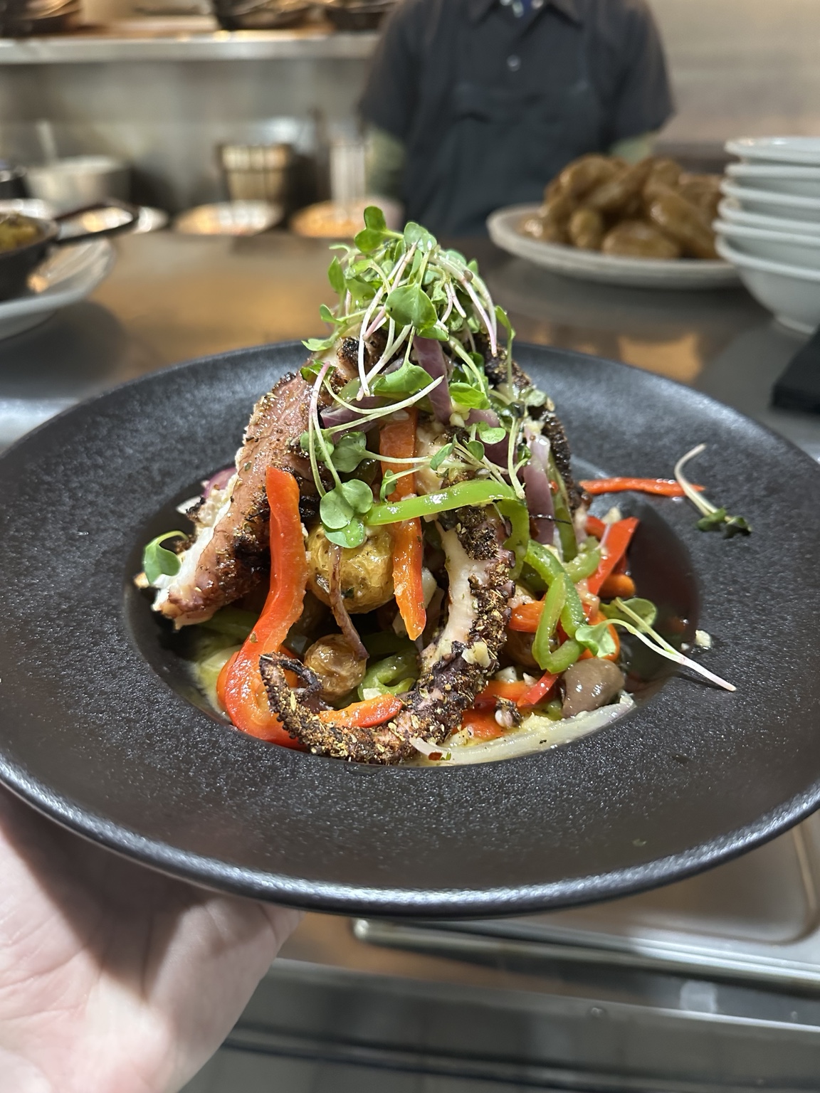Black Salt plated octopus dish